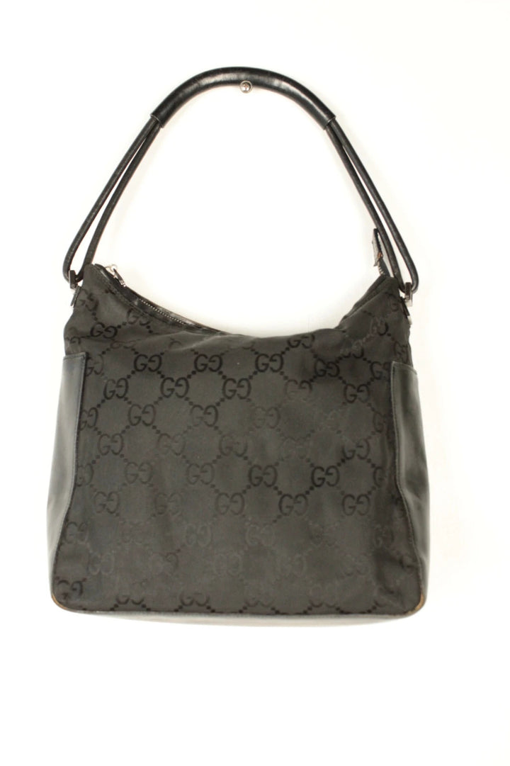 Gucci black hobo bag with GG monogram canvas, calf leather trim, and silver-tone hardware.