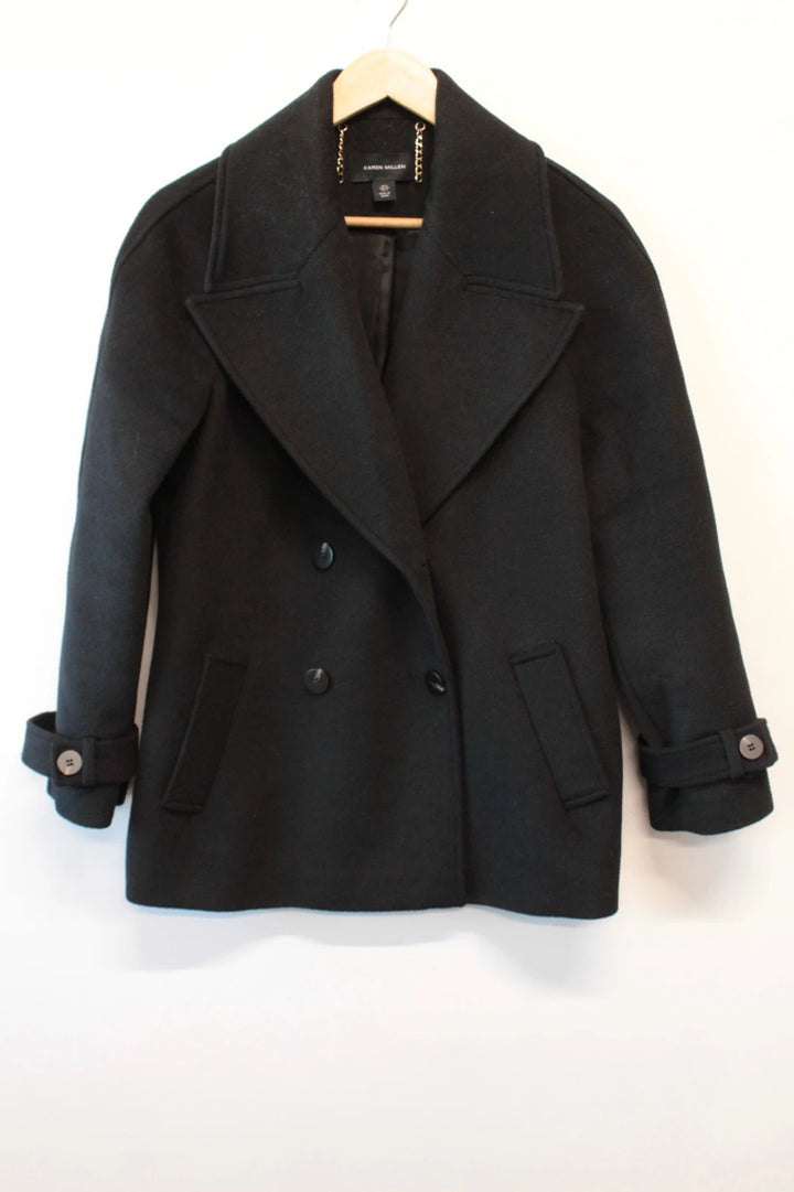 Karen Millen black double-breasted pea coat with tailored silhouette and gold hanging chain.