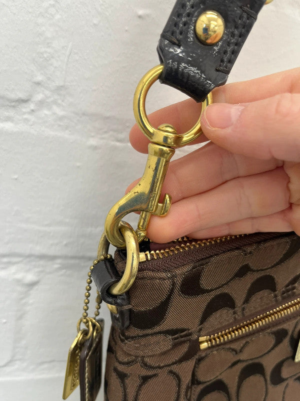 Coach brown monogram zip curved shoulder bag