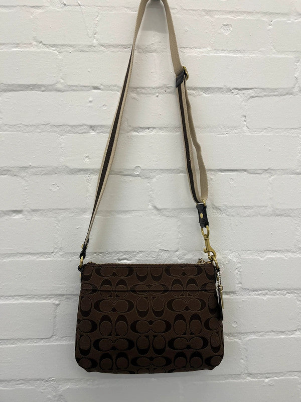 Coach brown monogram zip curved shoulder bag