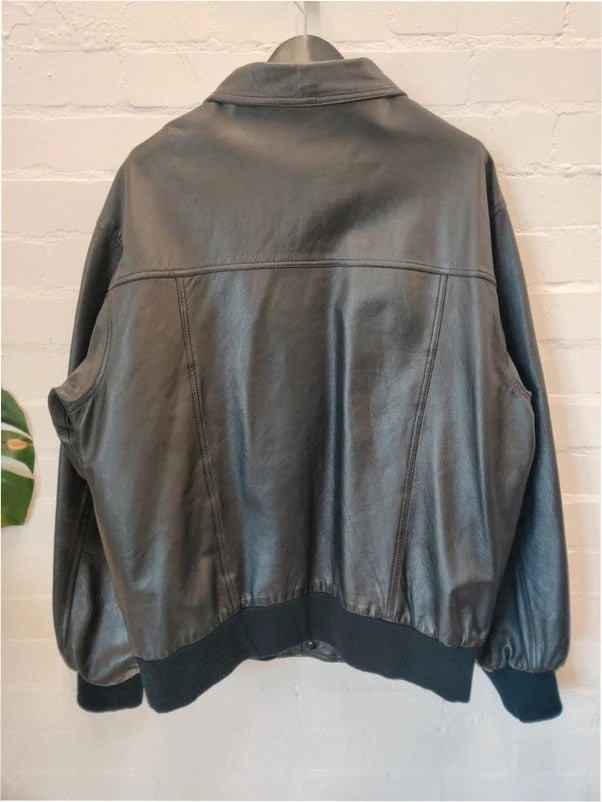 Premium black bomber jacket soft leather ribbed hem and cuffs aviator style.