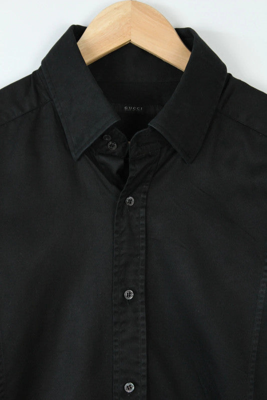 Gucci black long sleeve tailored shirt with precision-stitched panel darts and subtle sheen.