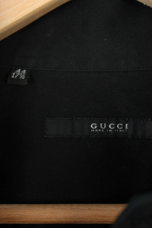 Gucci black long sleeve tailored shirt with precision-stitched panel darts and subtle sheen.
