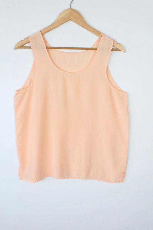 Vintage Dressing orange silk vest top with scoop neckline and minimalist design.