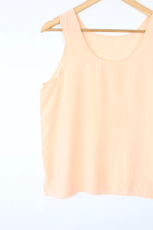 Vintage Dressing orange silk vest top with scoop neckline and minimalist design.