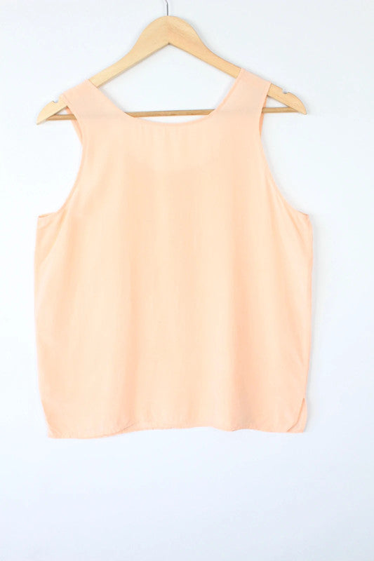 Vintage Dressing orange silk vest top with scoop neckline and minimalist design.