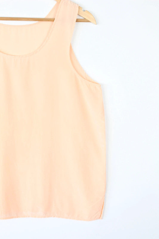 Vintage Dressing orange silk vest top with scoop neckline and minimalist design.