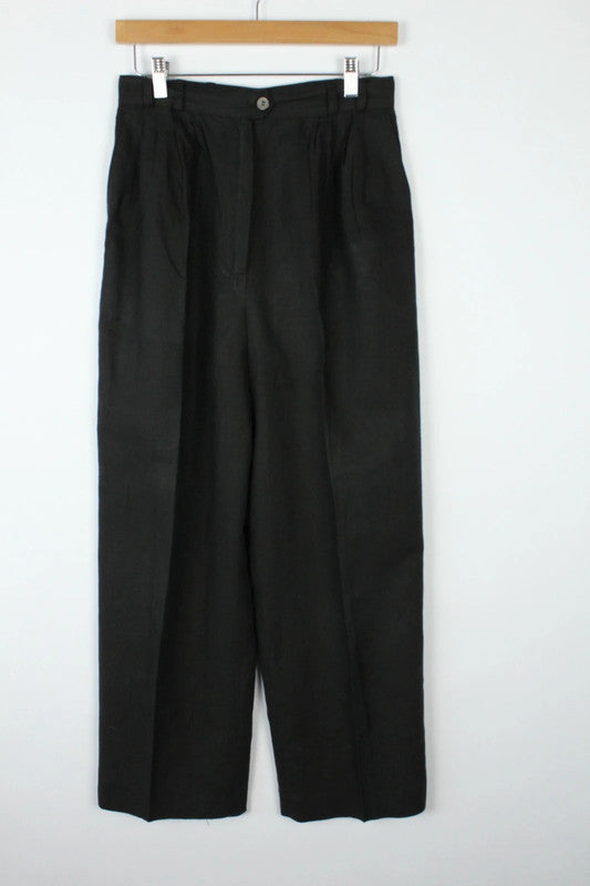 Rosner black linen wide-leg trousers with pleated front and center press crease.