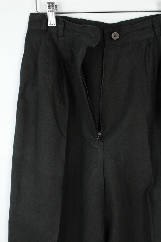 Rosner black linen wide-leg trousers with pleated front and center press crease.