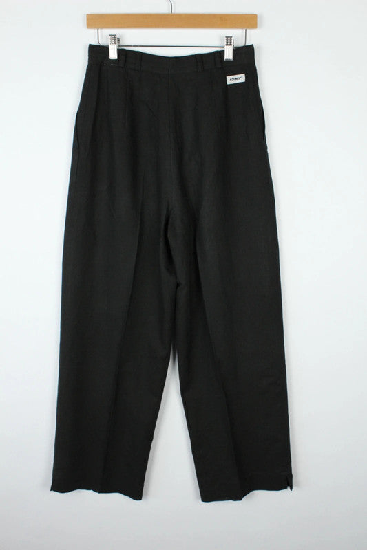 Rosner black linen wide-leg trousers with pleated front and center press crease.