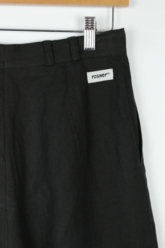 Rosner black linen wide-leg trousers with pleated front and center press crease.