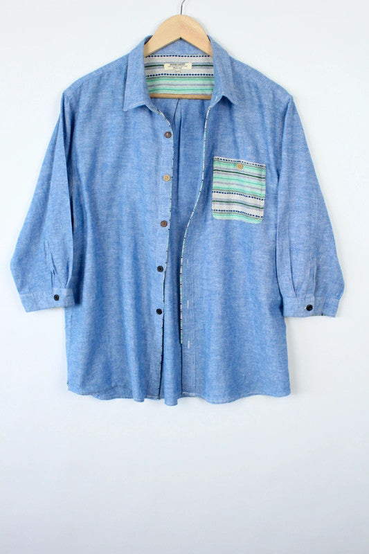 M2SQUARED blue linen tunic blouse with contrast striped pocket and 3/4 sleeves.