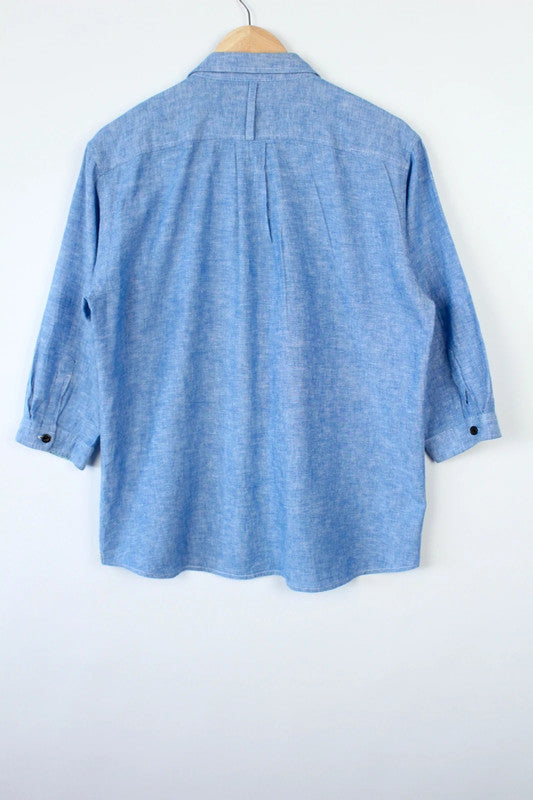 M2SQUARED blue linen tunic blouse with contrast striped pocket and 3/4 sleeves.