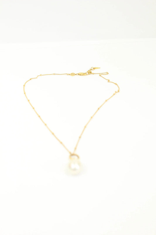 Missoma gold vermeil necklace with white freshwater pearl pendant and dainty satellite chain.
