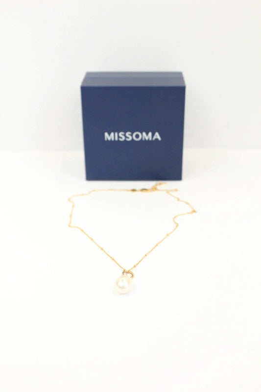 Missoma gold vermeil necklace with white freshwater pearl pendant and dainty satellite chain.