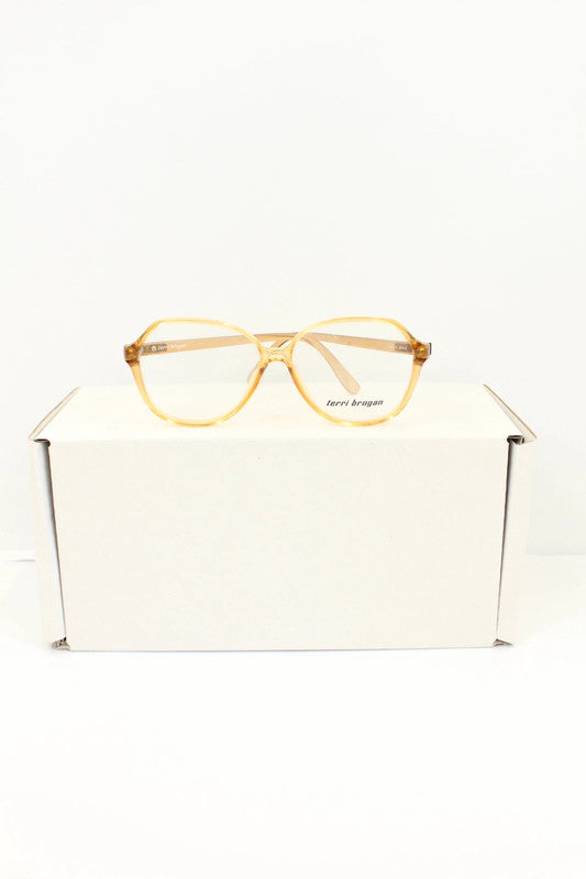 Optyl vintage sunglasses orange pink translucent oval frame with logo detail.