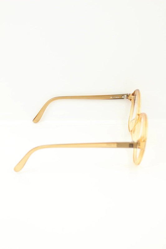 Optyl vintage sunglasses orange pink translucent oval frame with logo detail.