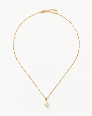 Missoma gold vermeil necklace with white freshwater pearl pendant and dainty satellite chain.