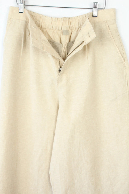 UNIQLO cream linen wide-leg culottes high-waisted with pleated front and tailored fit.