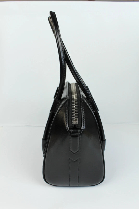 Givenchy black mini handbag with pentagonal logo patch and silver-tone hardware.