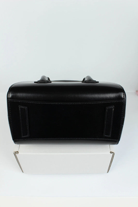 Givenchy black mini handbag with pentagonal logo patch and silver-tone hardware.