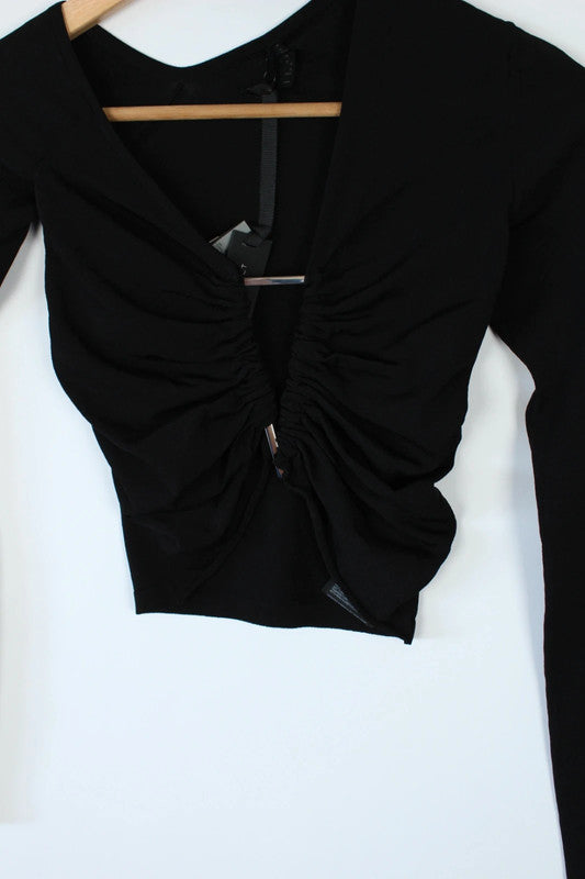 Ben Taverniti Unravel Project black asymmetric cut-out turtleneck vest in soft stretch knit.