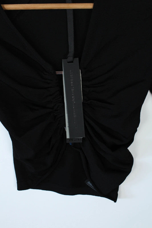 Ben Taverniti Unravel Project black asymmetric cut-out turtleneck vest in soft stretch knit.