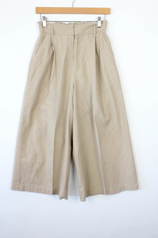 Niko and beige linen wide-leg culottes with high waist and minimalist design.