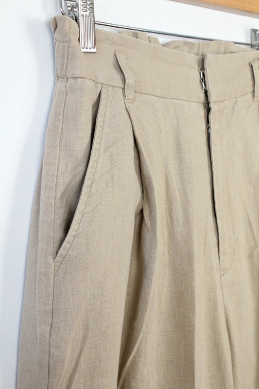 Niko and beige linen wide-leg culottes with high waist and minimalist design.