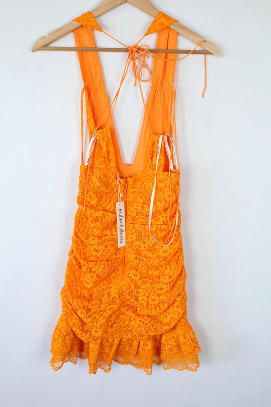 For Love & Lemons orange lace mini dress with floral pattern and plunge V-neckline.