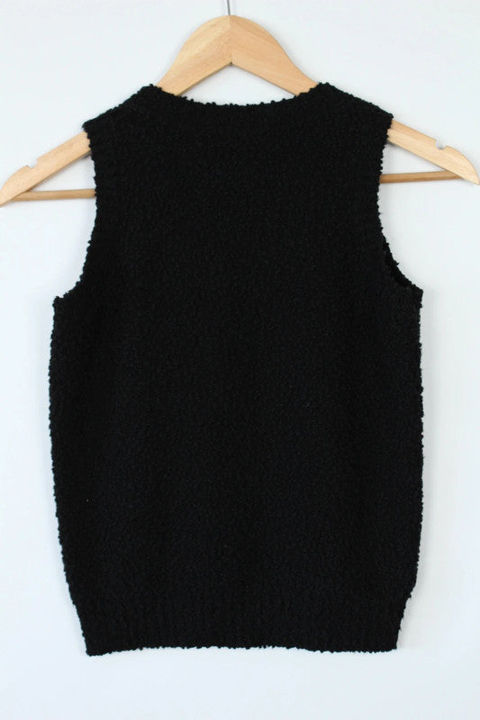 Christian Dior black sleeveless vest top with bouclé texture and scoop neck design.