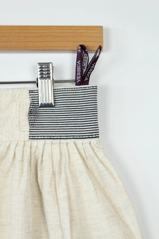 Yessica cream high-waisted linen trousers with elasticated pinstripe and front pleating details.