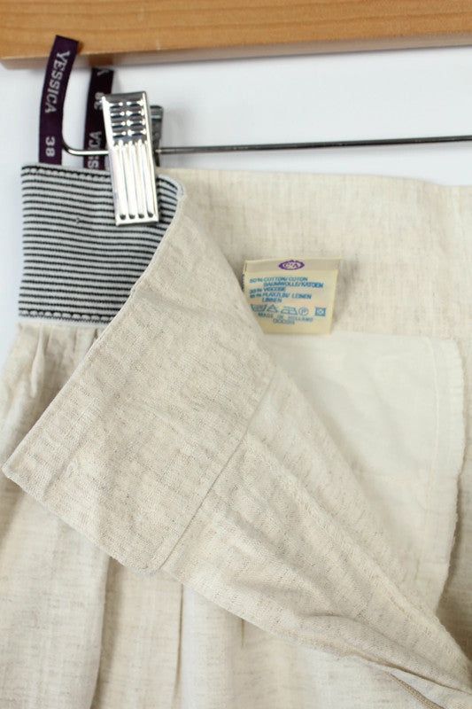 Yessica cream high-waisted linen trousers with elasticated pinstripe and front pleating details.
