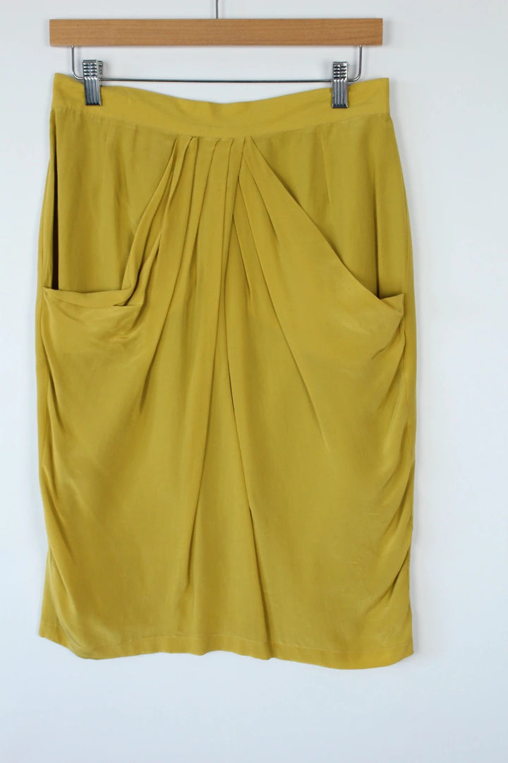Vintage Dressing yellow silk pleated tulip skirt with drape details and side pockets.