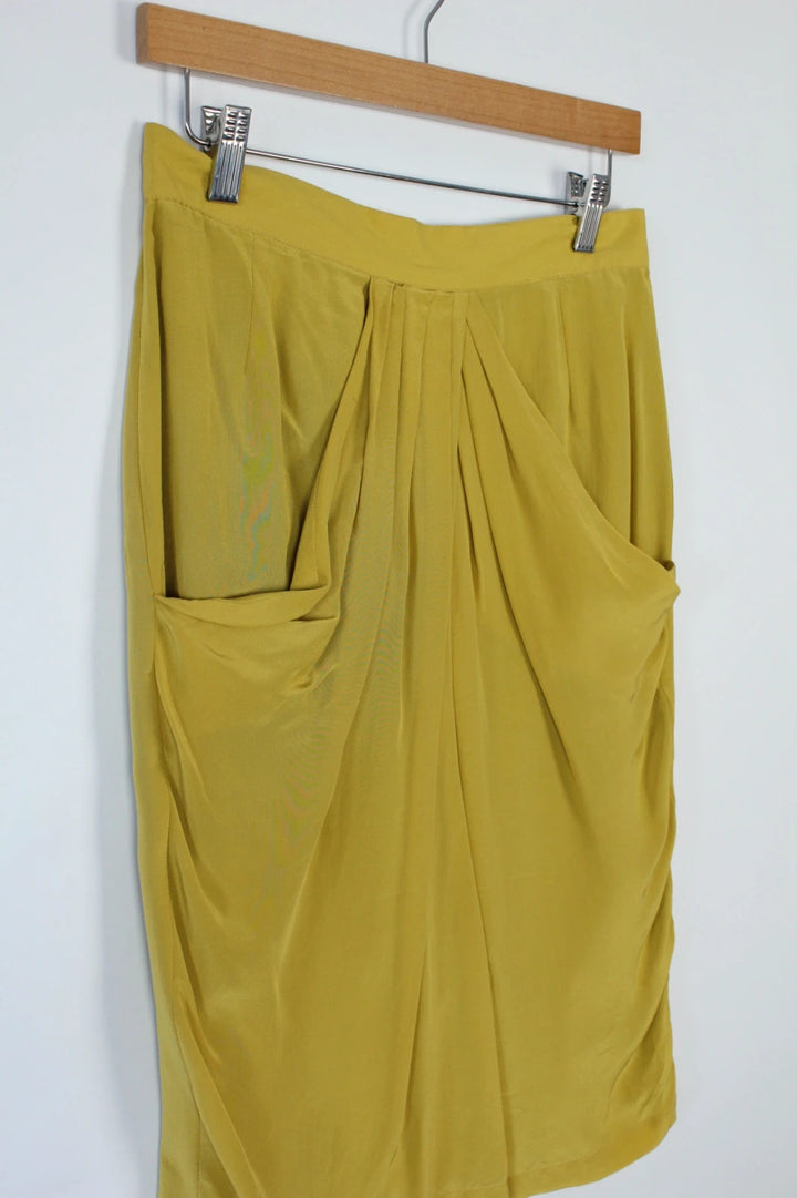 Vintage Dressing yellow silk pleated tulip skirt with drape details and side pockets.