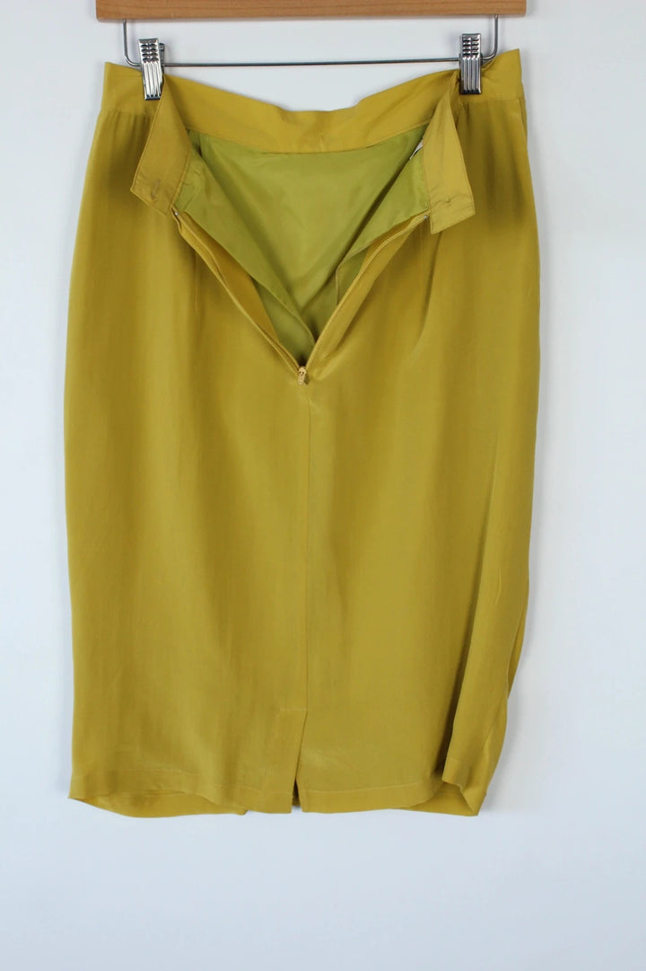 Vintage Dressing yellow silk pleated tulip skirt with drape details and side pockets.
