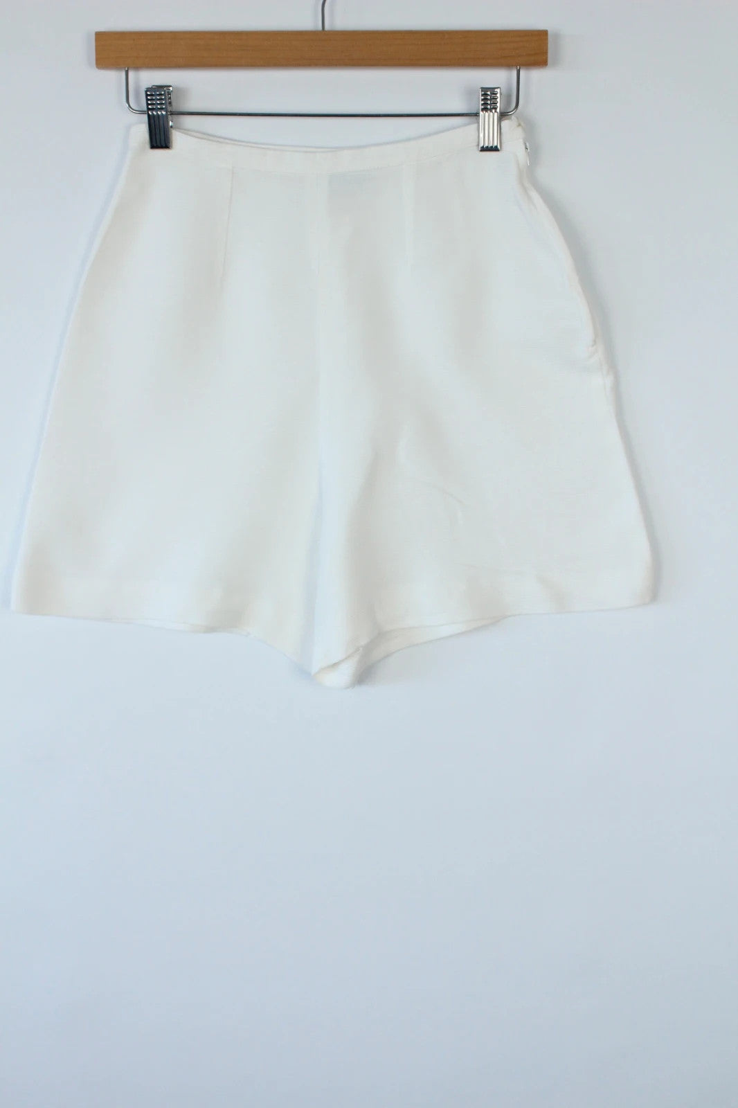 Prisma white tailored shorts, high-waisted A-line fit, clean concealed side zip, cotton blend.