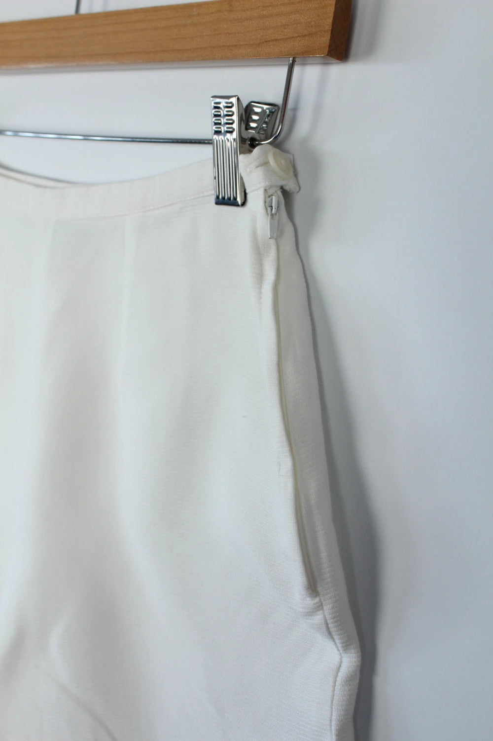 Prisma white tailored shorts, high-waisted A-line fit, clean concealed side zip, cotton blend.