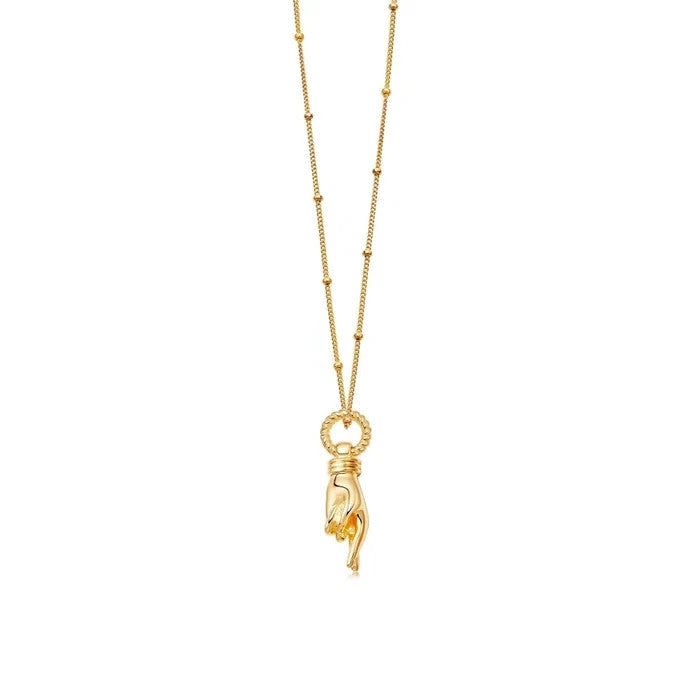 Missoma gold necklace with Good Luck charm pendant and Orb chain design.