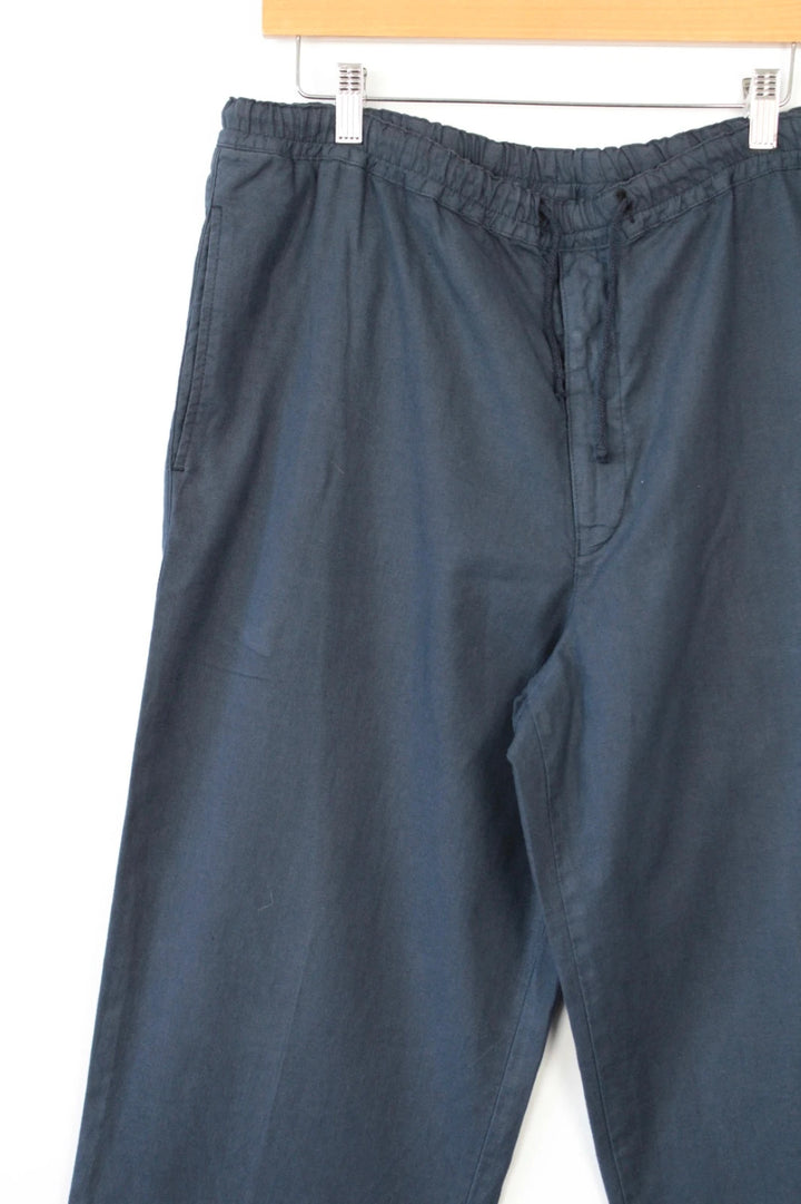 Barneys New York navy blue wide-leg trousers, drawstring waist, cotton linen blend fabric.