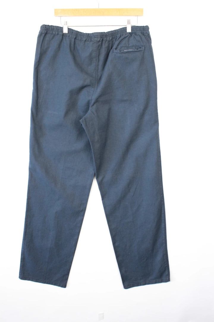 Barneys New York navy blue wide-leg trousers, drawstring waist, cotton linen blend fabric.