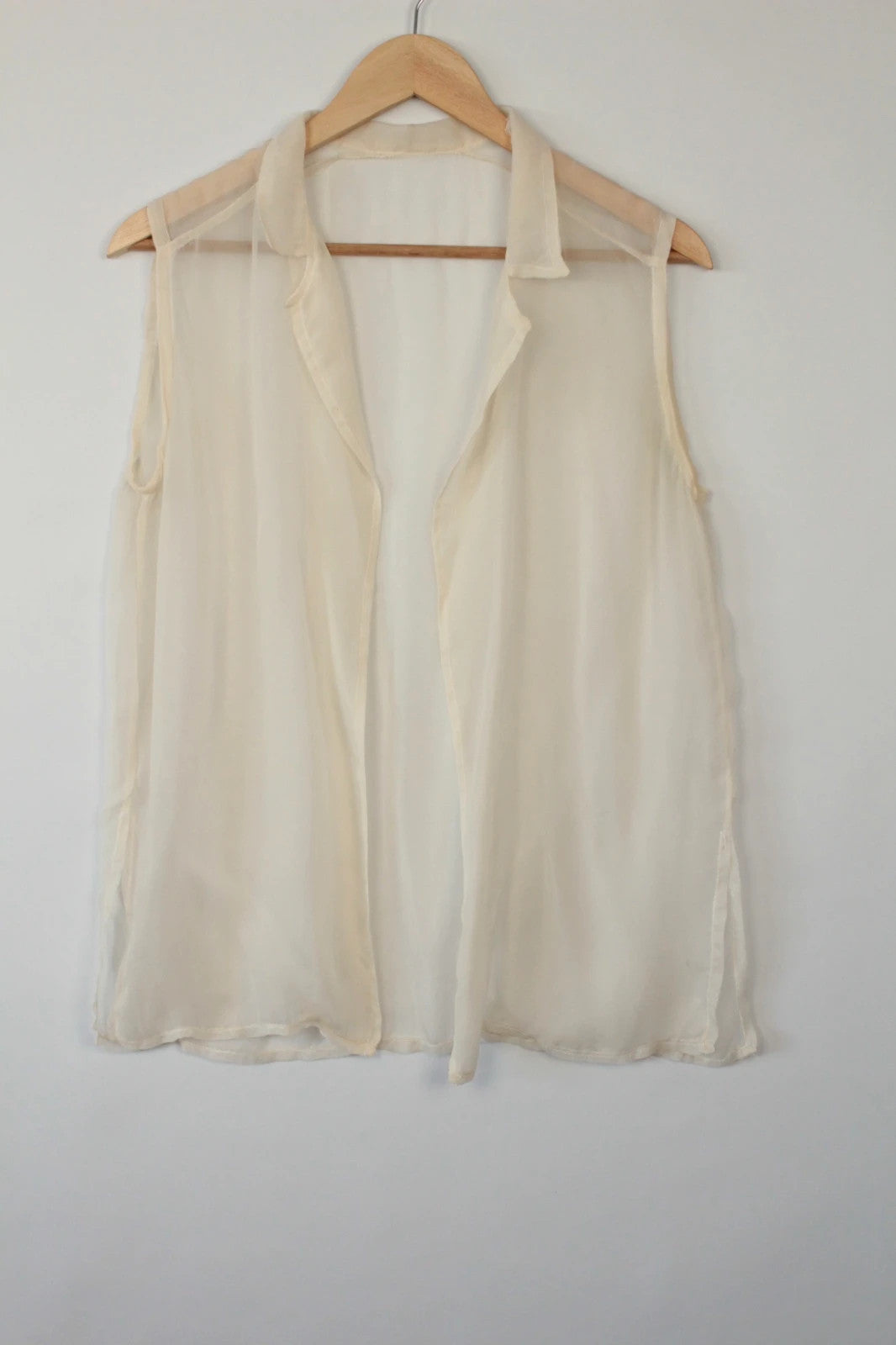Vintage Dressing cream sleeveless silk tunic blouse with collared neck and sheer fabric.