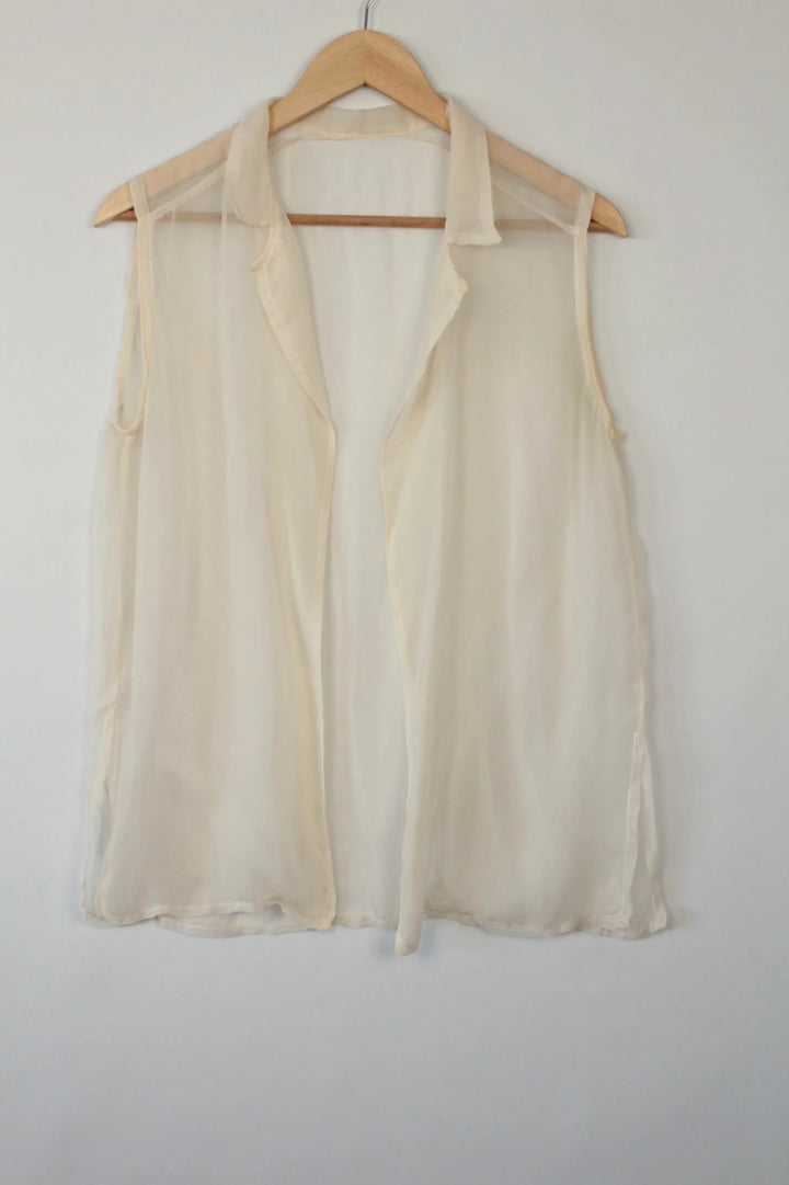 Vintage Dressing cream sleeveless silk tunic blouse with collared neck and sheer fabric.
