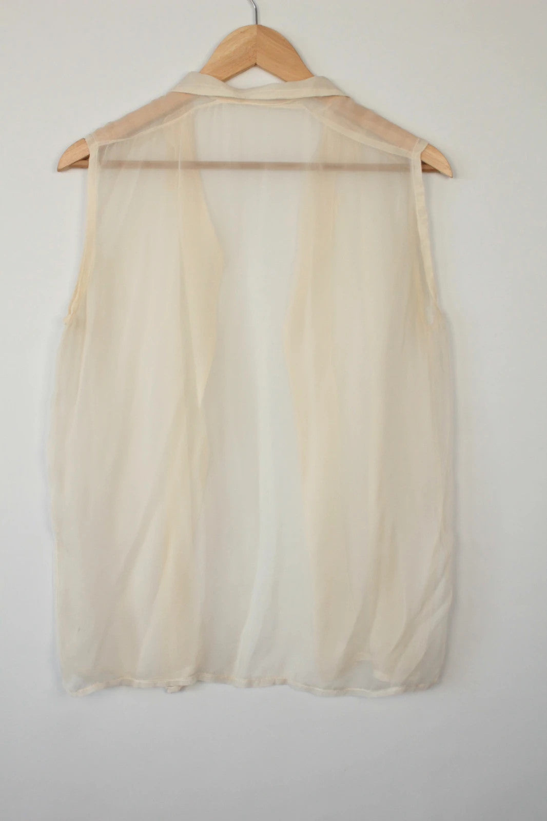Vintage Dressing cream sleeveless silk tunic blouse with collared neck and sheer fabric.