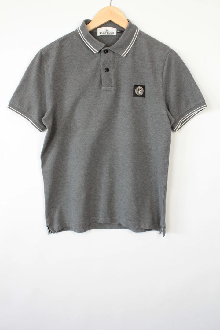 Stone Island grey polo shirt with twin tipped collar and compass badge logo.