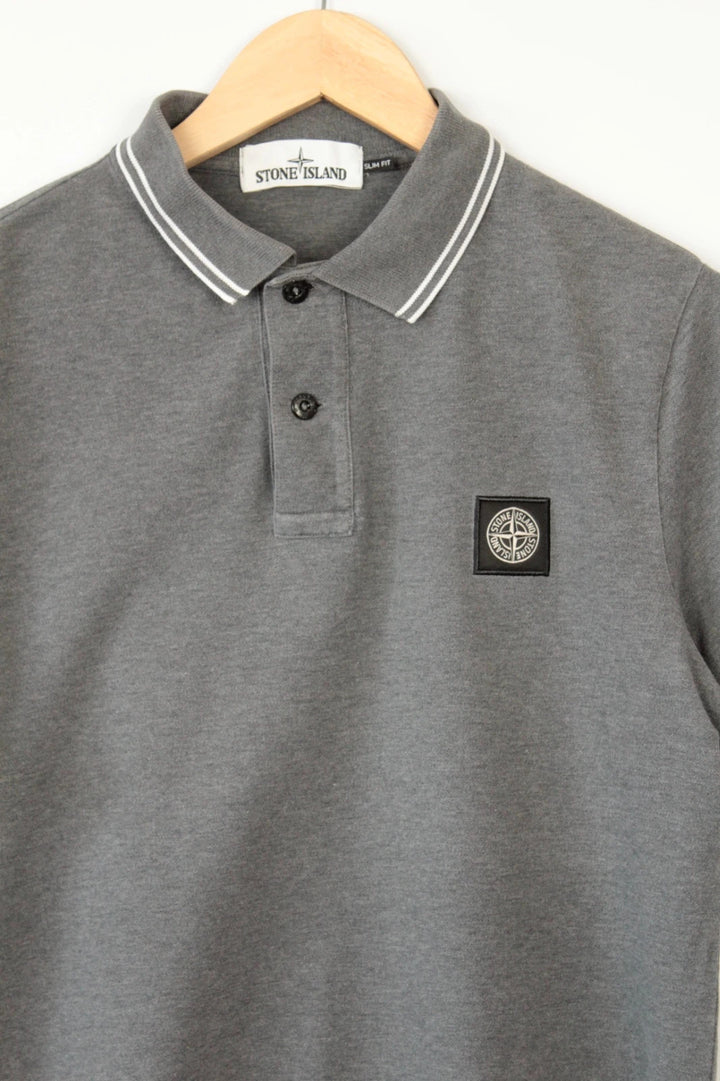 Stone Island grey polo shirt with twin tipped collar and compass badge logo.
