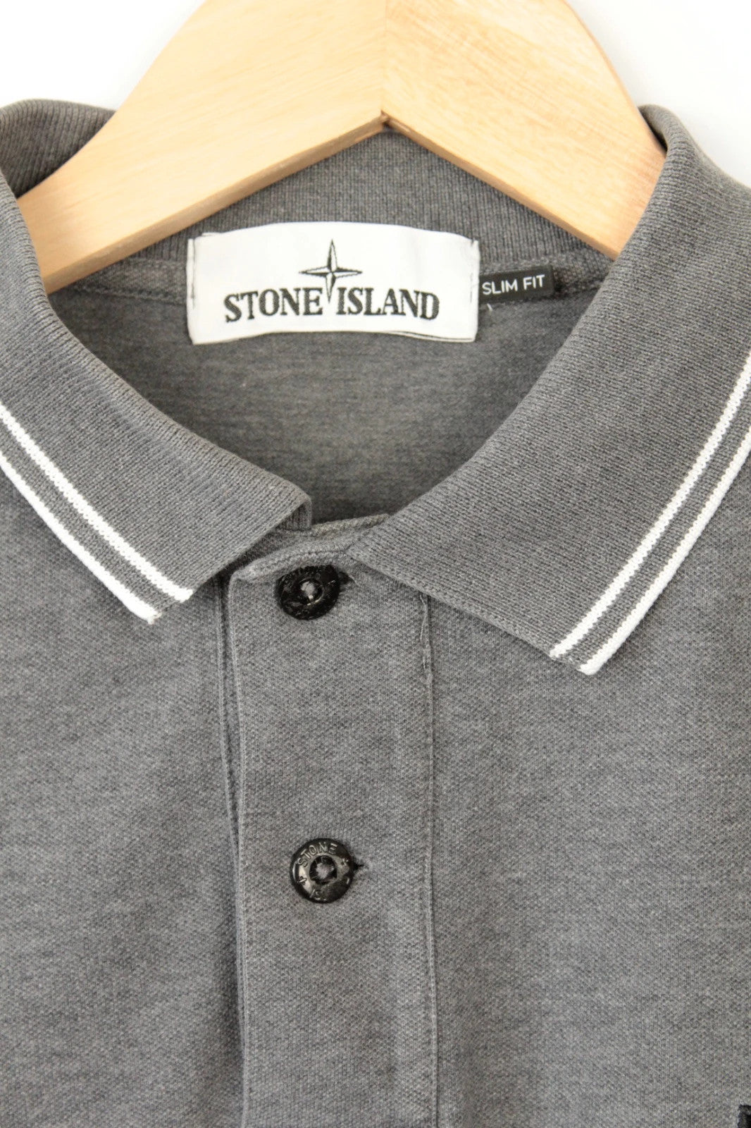 Stone Island grey polo shirt with twin tipped collar and compass badge logo.