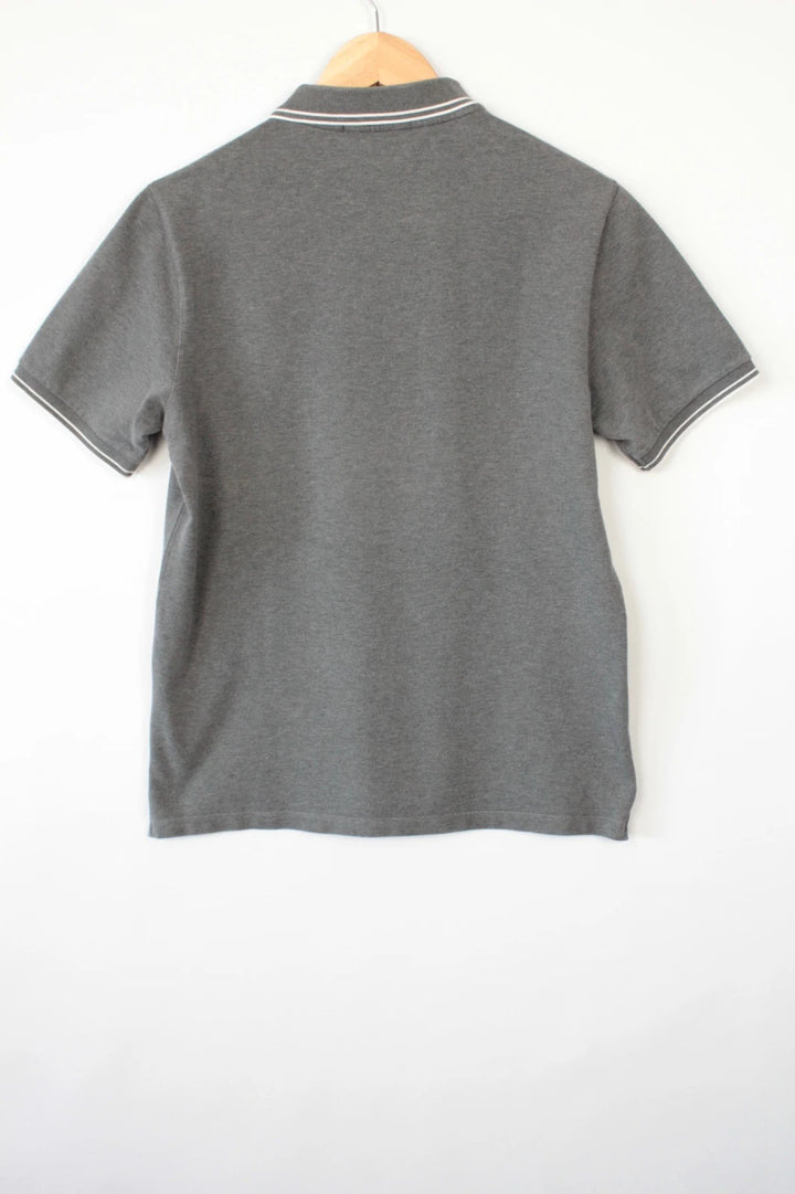 Stone Island grey polo shirt with twin tipped collar and compass badge logo.