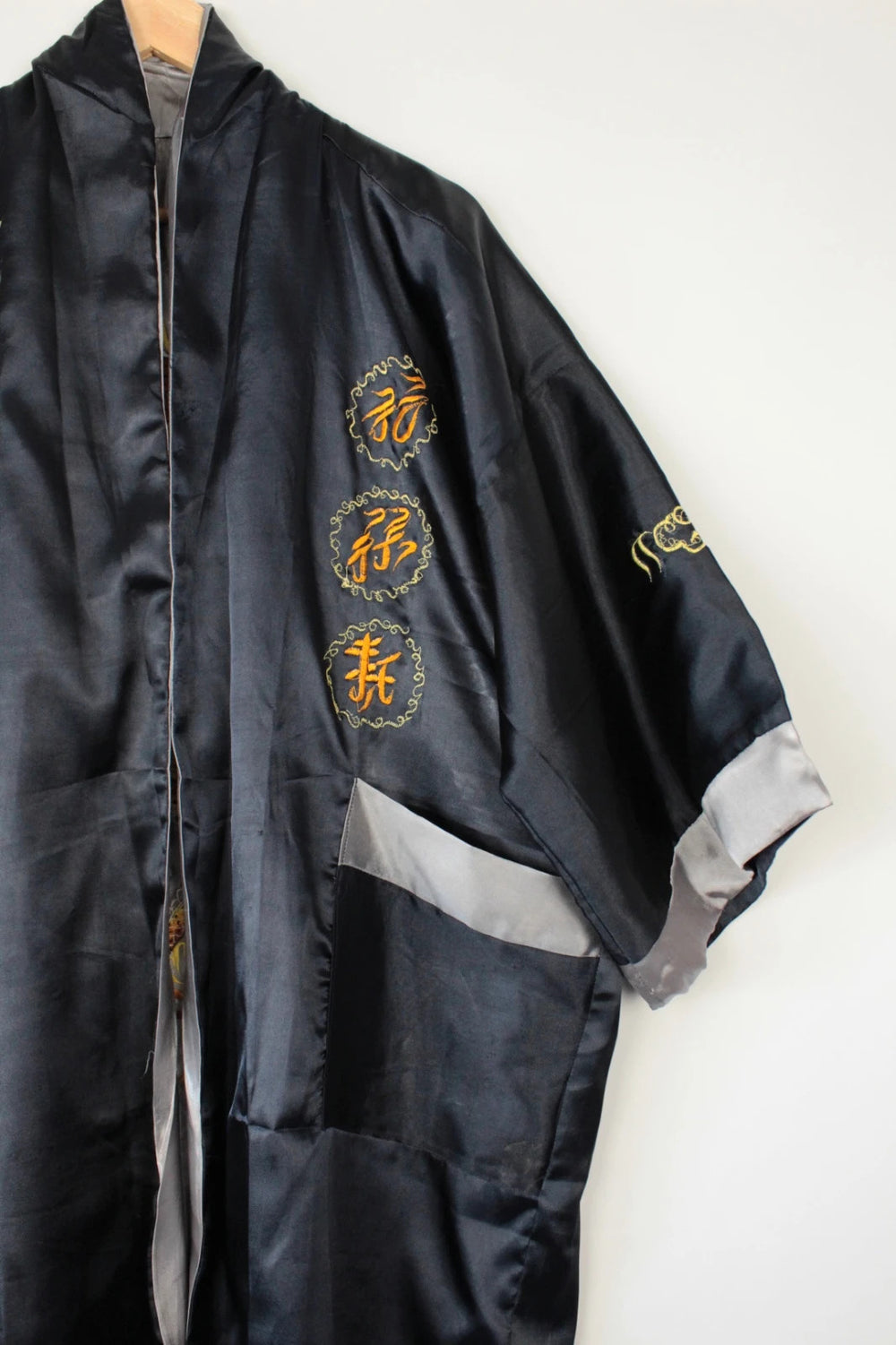 Japan Style reversible kimono robe black satin with gold dragon embroidery and kanji symbols.