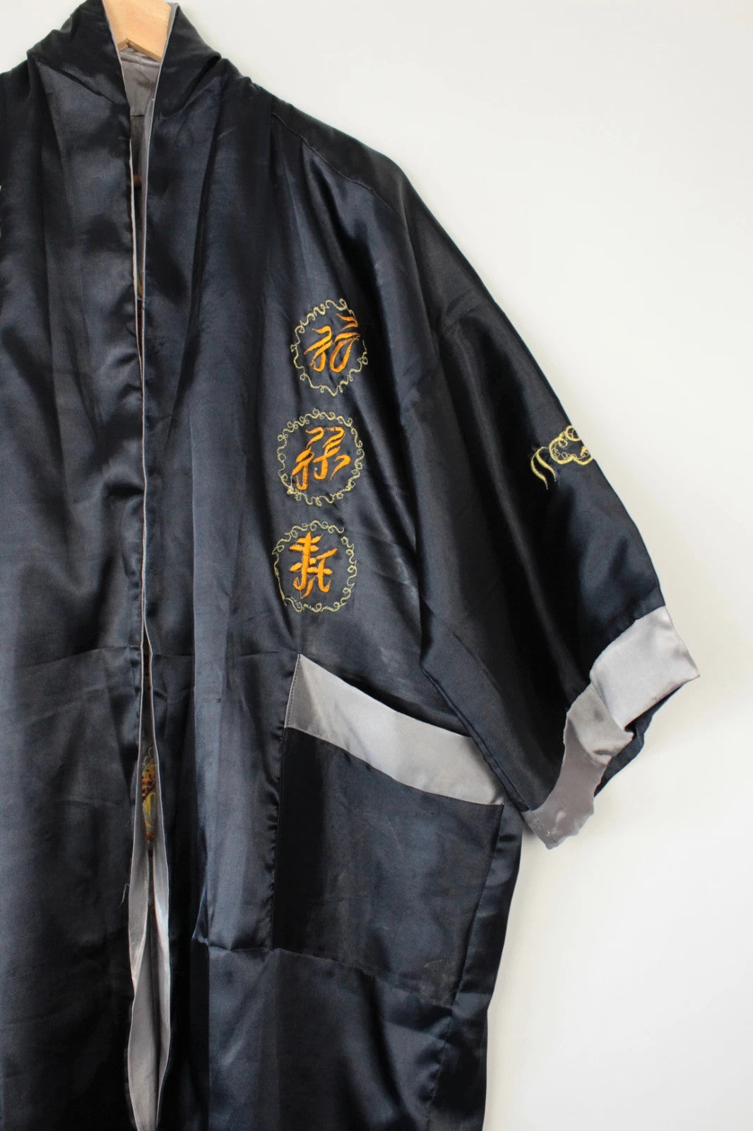 Japan Style reversible kimono robe black satin with gold dragon embroidery and kanji symbols.